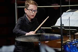 Miko Moon in childhood during his musical beginnings.