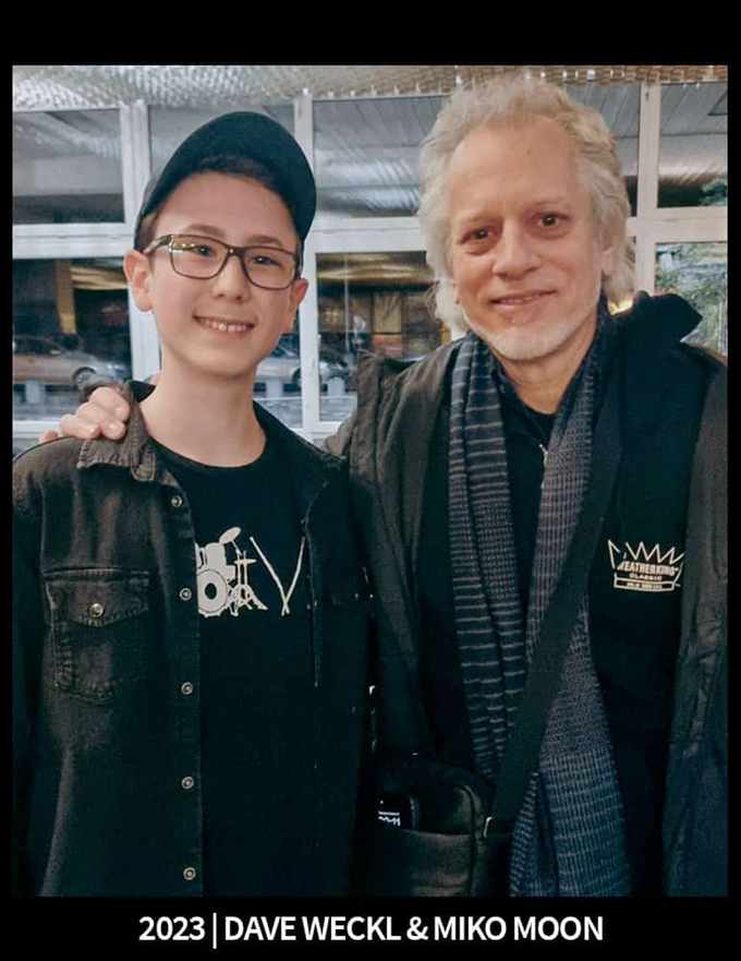 Miko Moon and Dave Weckl during a meeting.