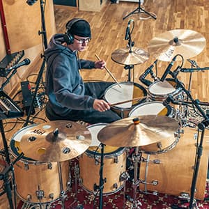 Miko Moon during a drum recording session in the studio.