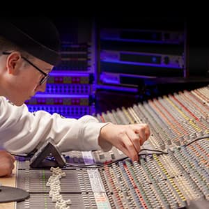 Microphones positioned around the drums during a recording session.