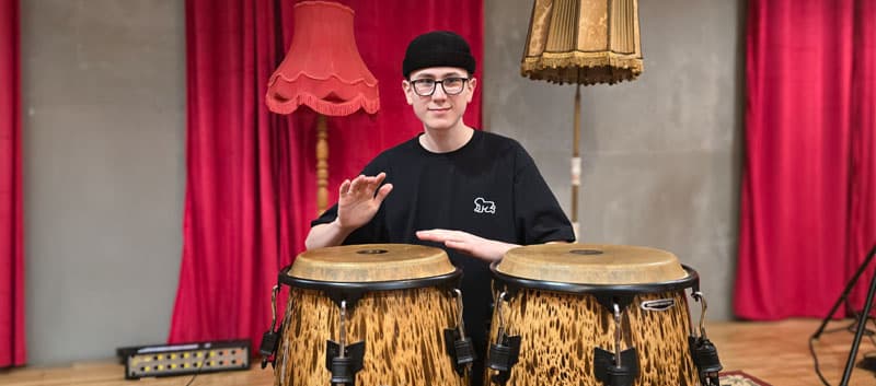 Miko Moon with percussion instruments.