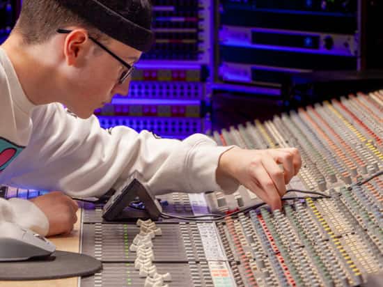 Sound engineer workstation in a recording studio.