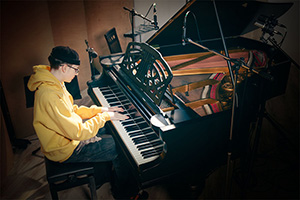 Miko Moon plays piano.