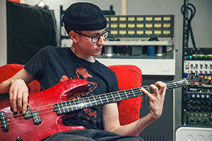 Miko Moon plays bass guitar.